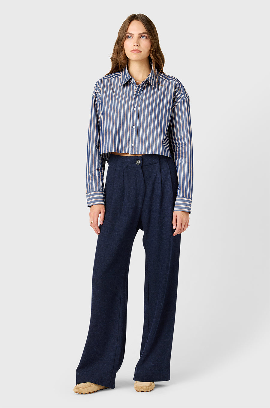 Model wearing the lady & the sailor Cropped Boxy Button Up in Indigo Stripe.