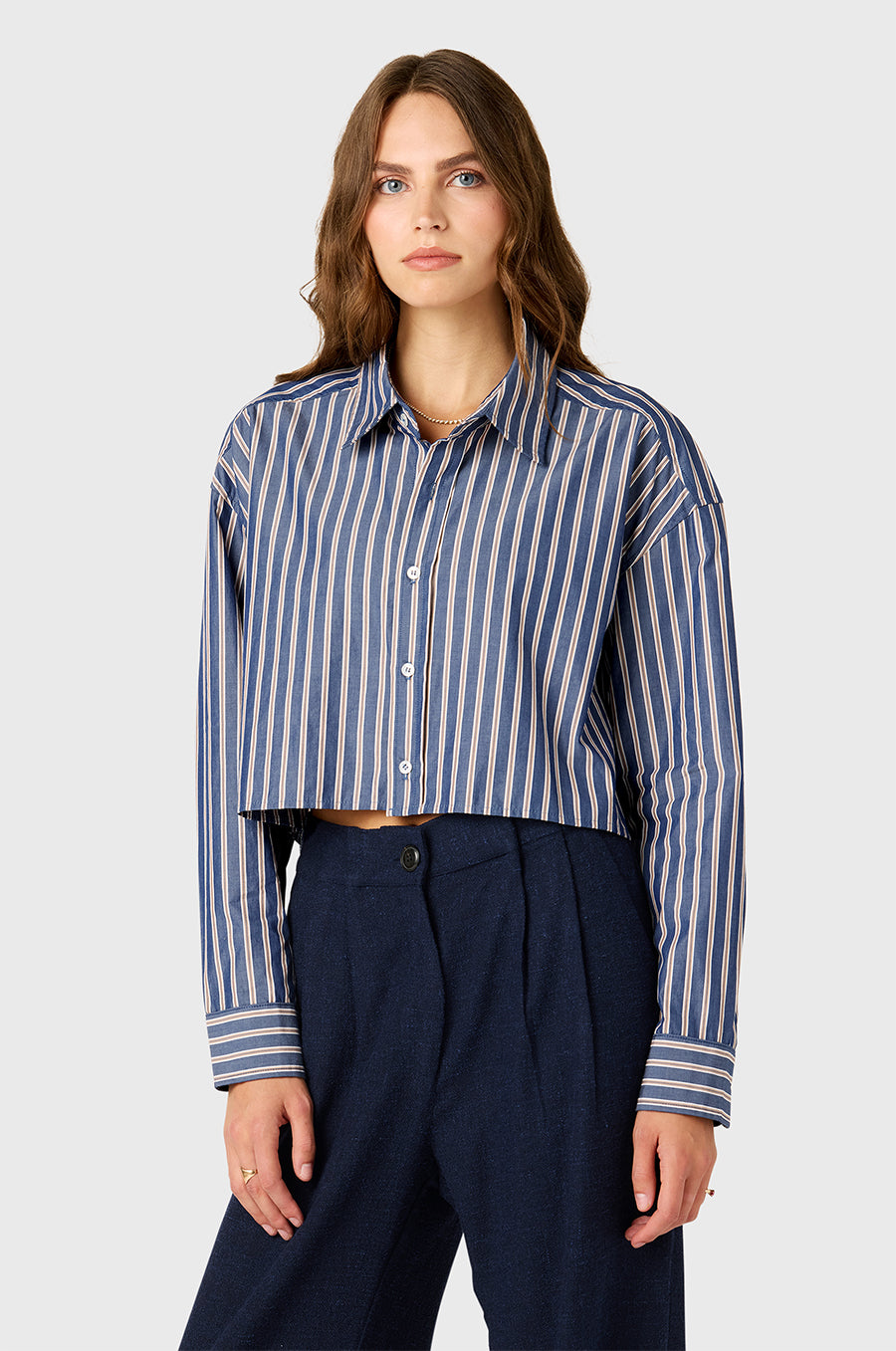 Model wearing the lady & the sailor Cropped Boxy Button Up in Indigo Stripe.