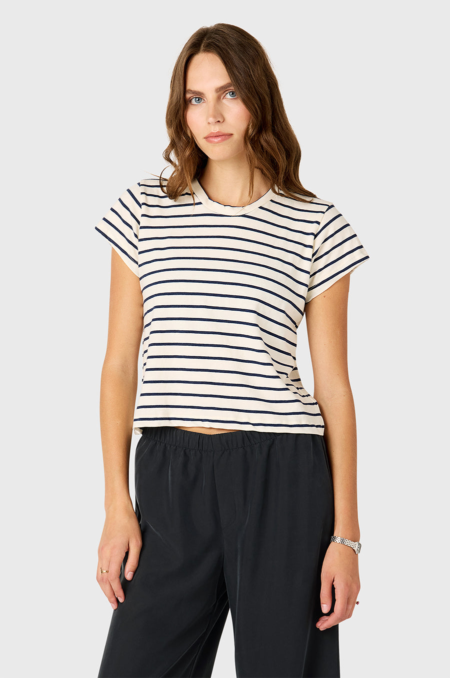 Model wearing The Lady & The Sailor Shrunken BF Tee in Navy Stripe and Silky Wide Leg Pant in Washed Black.