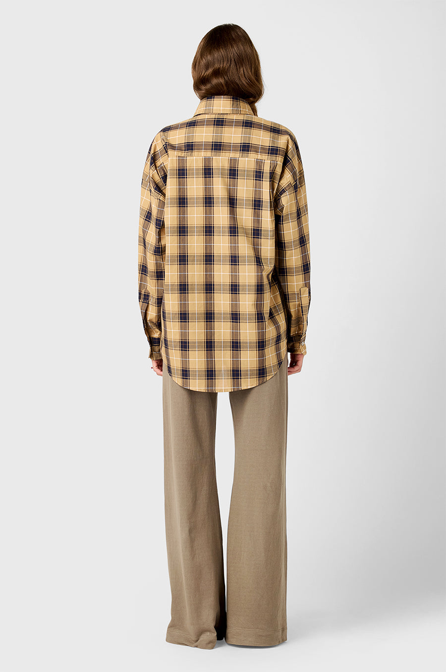Model wearing The Lady & The Sailor Sunday Shirt in Camel Plaid and Wide Leg Pant in Morel.