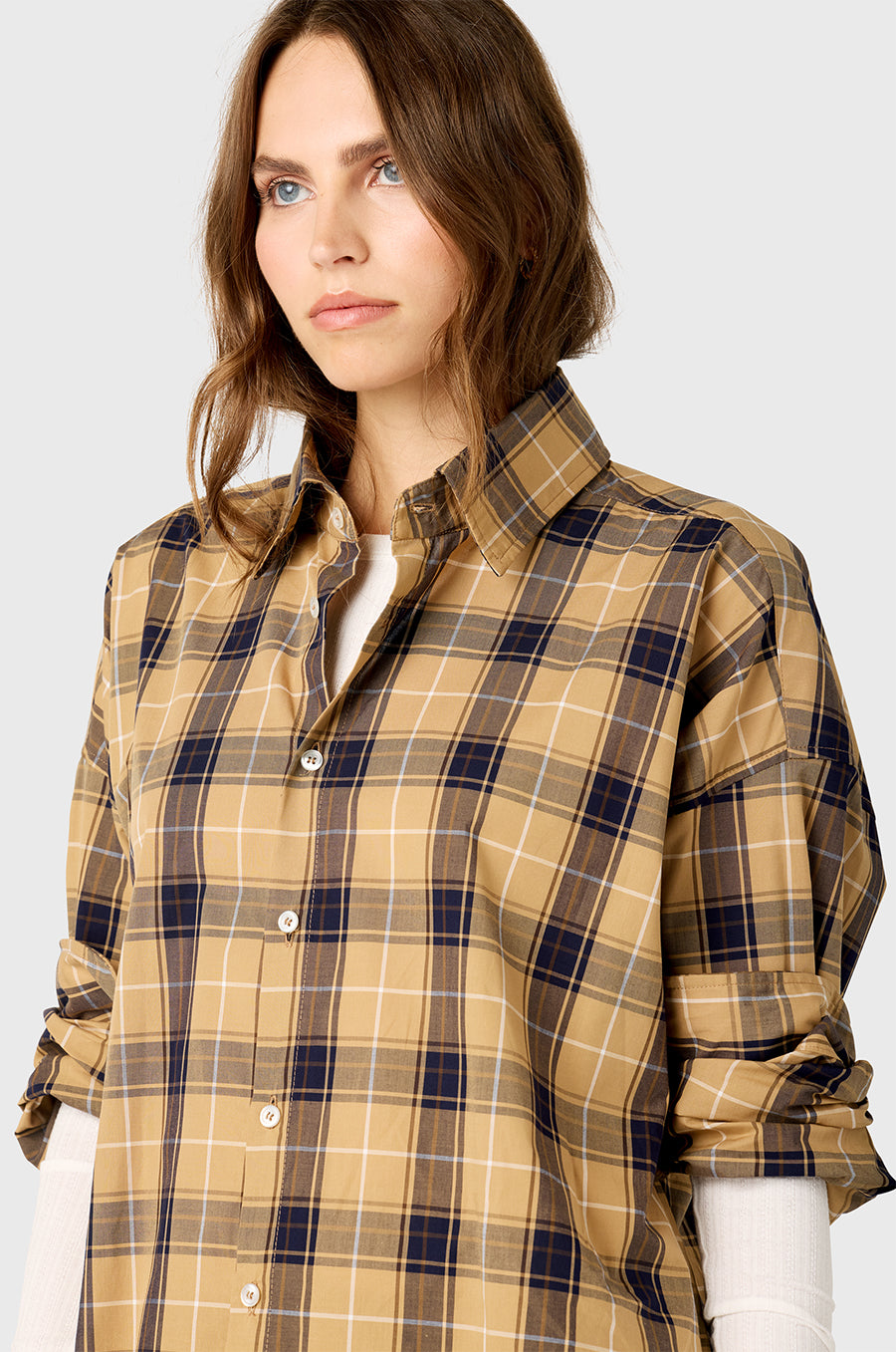 Model wearing The Lady & The Sailor Sunday Shirt in Camel Plaid, an oversized button up.