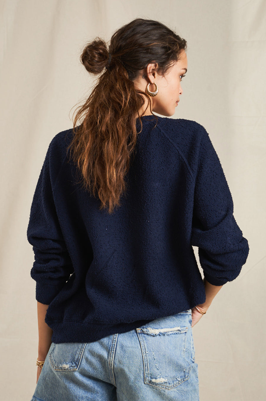 Model wearing the lady & the sailor Brentwood Sweatshirt in Navy Boucle.
