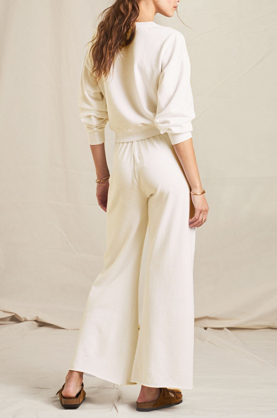 Model wearing the lady & the sailor French Flare Pant in Vanilla Organic Cotton.
