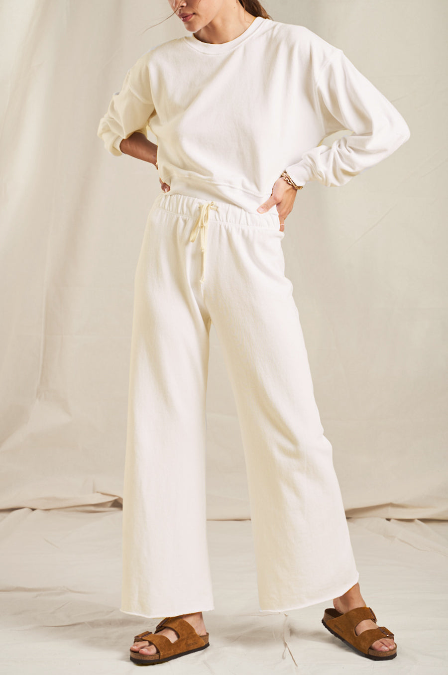 Model wearing the lady & the sailor French Flare Pant in Vanilla Organic Cotton.