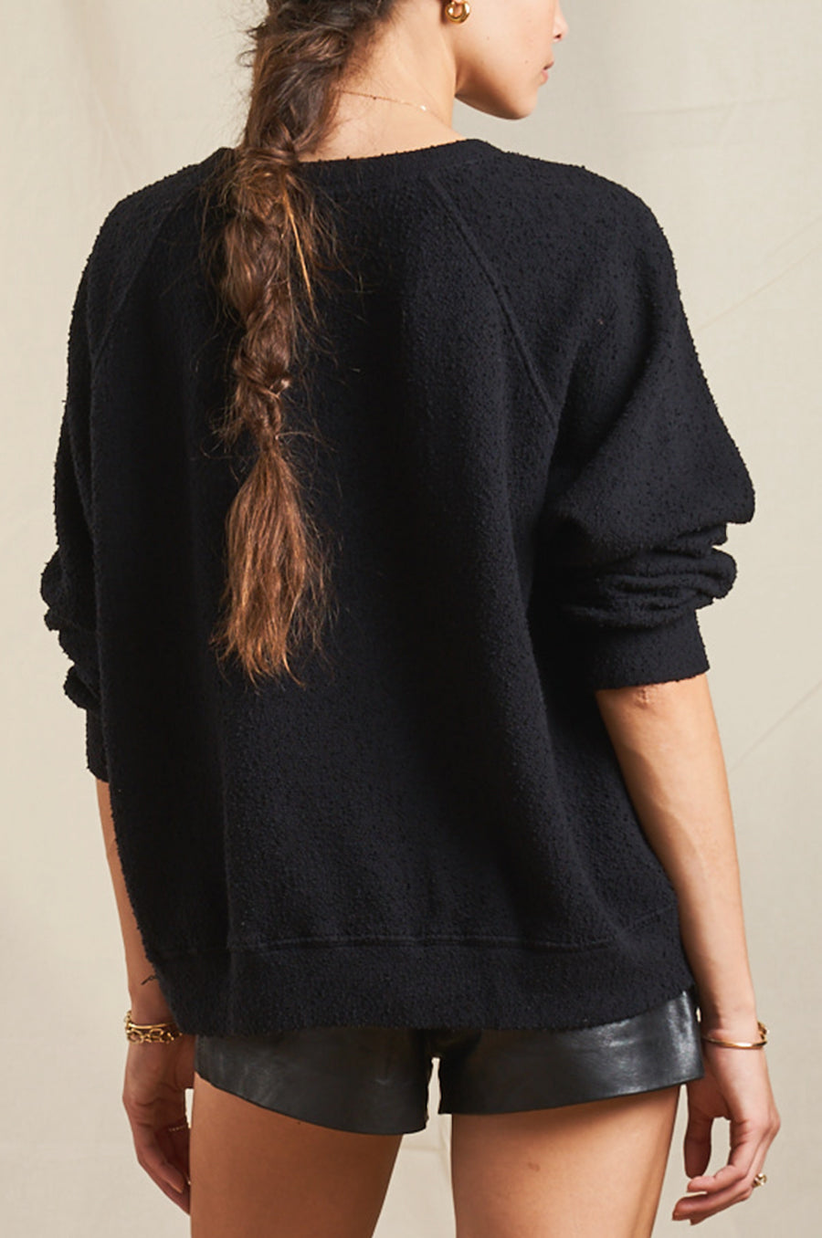 Model wearing the lady & the sailor Brentwood Sweatshirt in Black Boucle.