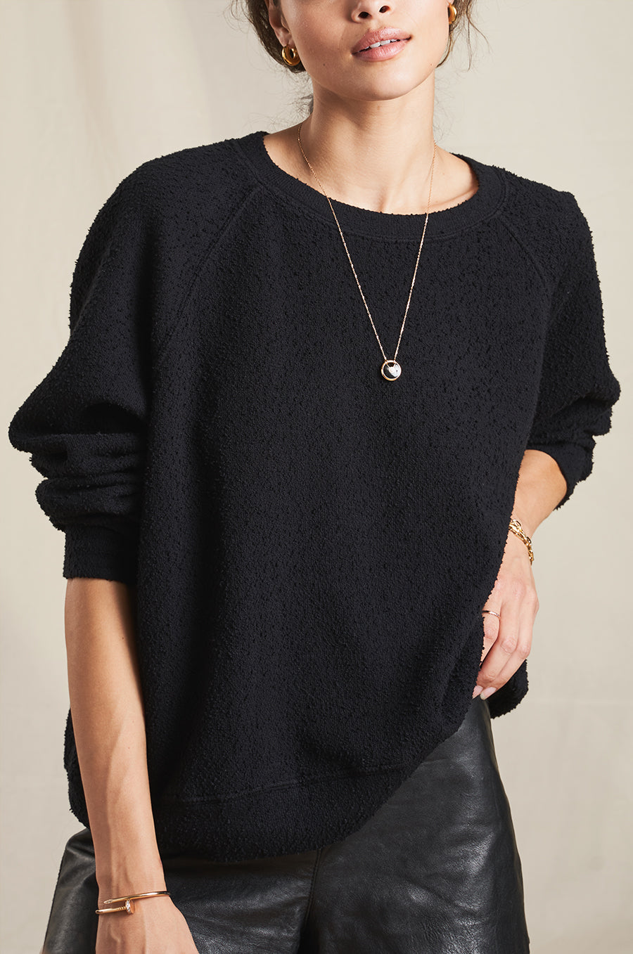 Model wearing the lady & the sailor Brentwood Sweatshirt in Black Boucle.