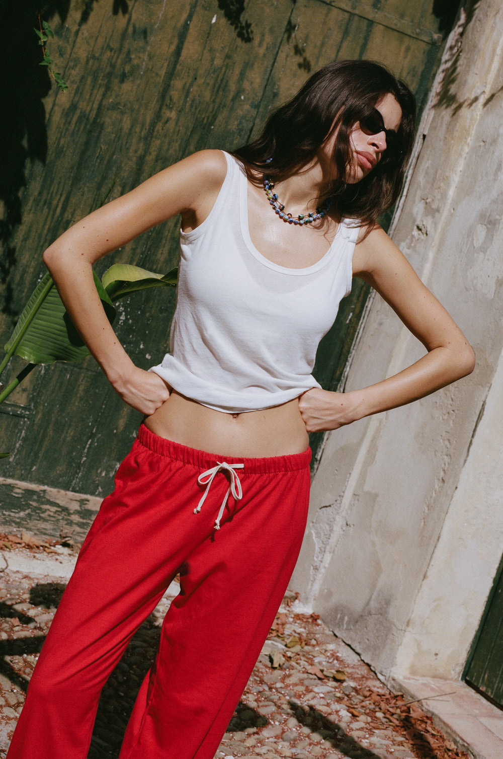 the relaxed sweatpant in red jersey styled with the feather scoop tank in white sheer cotton - the lady & the sailor