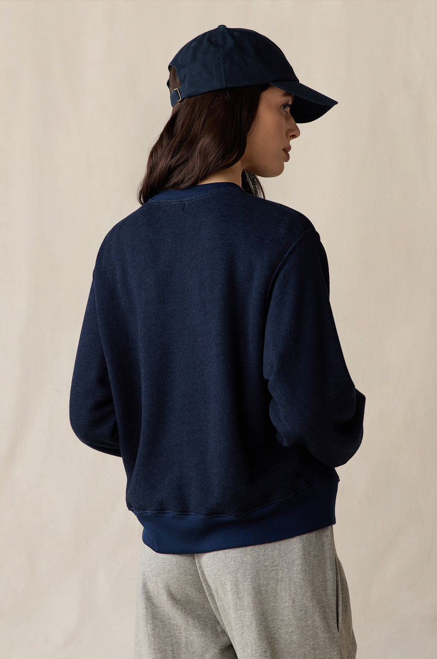 Relaxed Fleece Sweatshirt in indigo, styled with the Relaxed Pocket Sweatpant in heather grey terry, Shrunken BF Tee in white and Lady Classic Cap in navy - the lady & the sailor