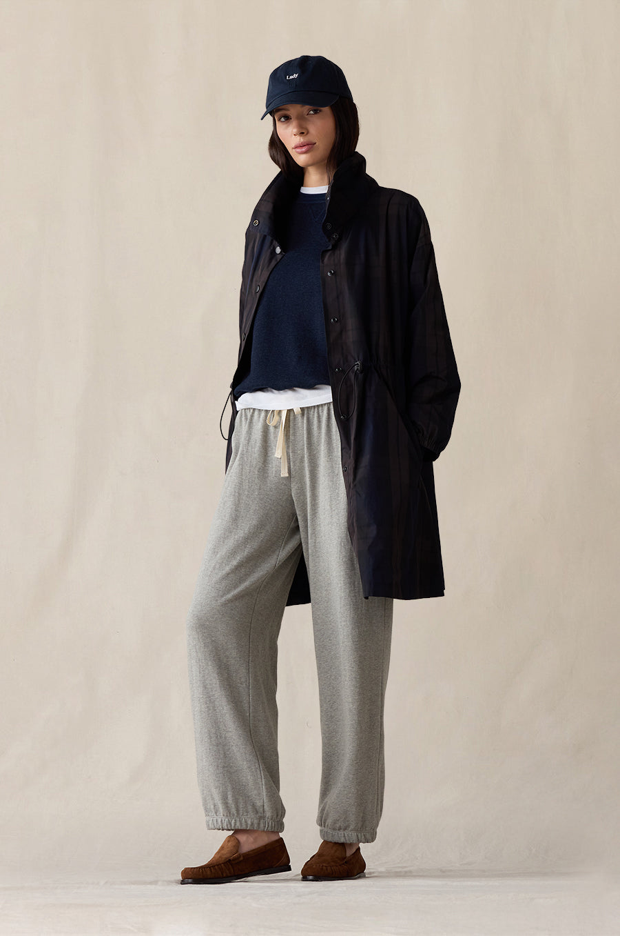 Relaxed Fleece Sweatshirt in indigo, styled with the Anorak Jacket in midnight tartan, Relaxed Pocket Sweatpant in heather grey terry, Shrunken BF Tee in white and Lady Classic Cap in navy - the lady & the sailor