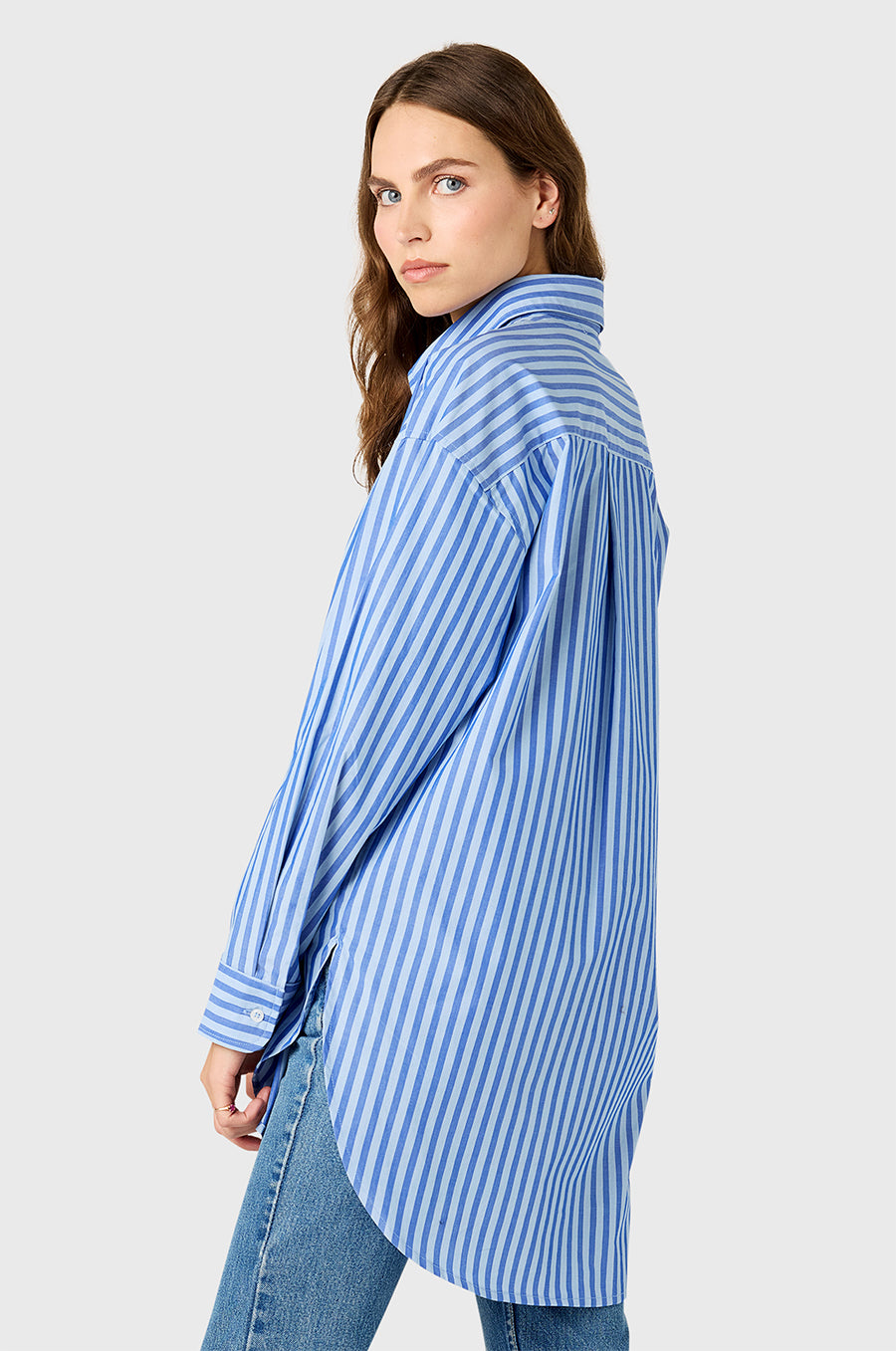 Model wearing The Lady & The Sailor Curved Hem Button up in French Blue Stripe.