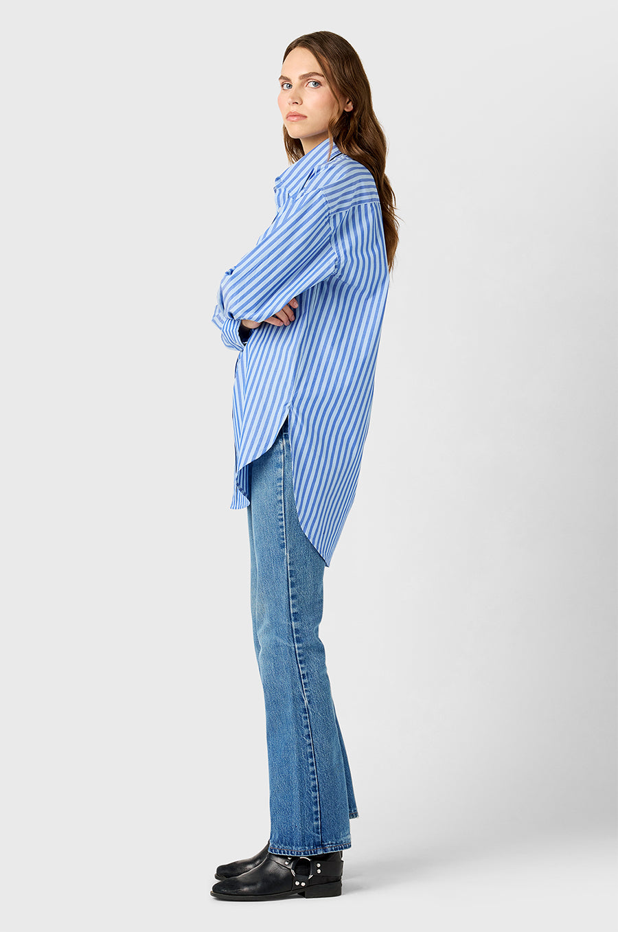 Model wearing The Lady & The Sailor Curved Hem Button up in French Blue Stripe.