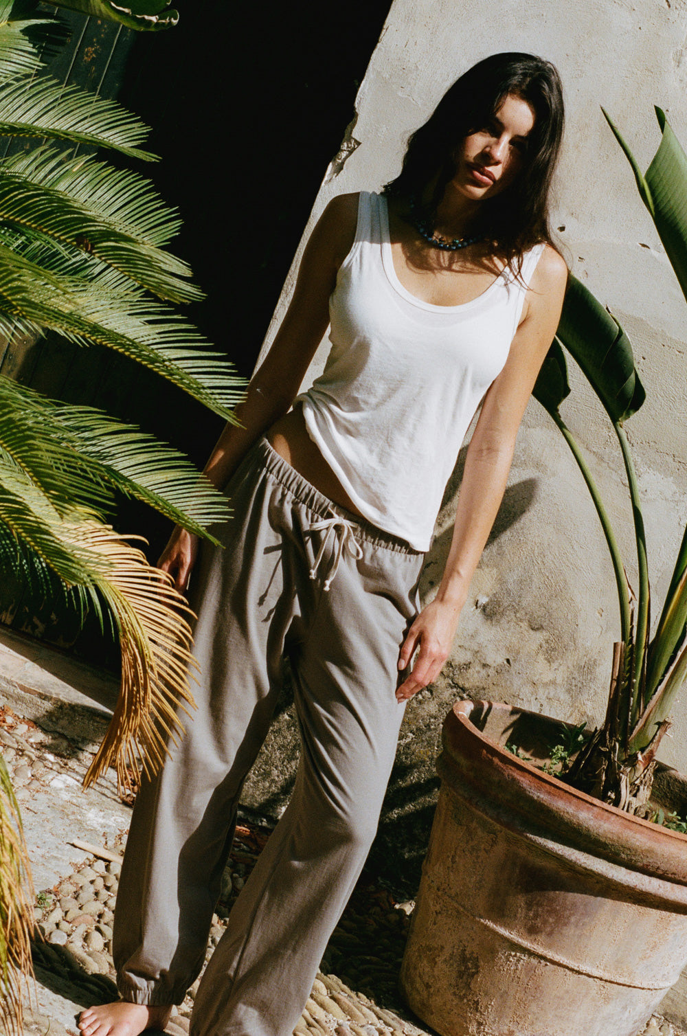 Relaxed sweatpant in taupe jersey styled with the feather scoop tank in white sheer cotton - the lady & the sailor