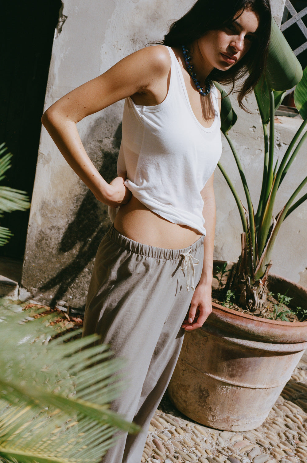Relaxed sweatpant in taupe jersey styled with the feather scoop tank in white sheer cotton - the lady & the sailor