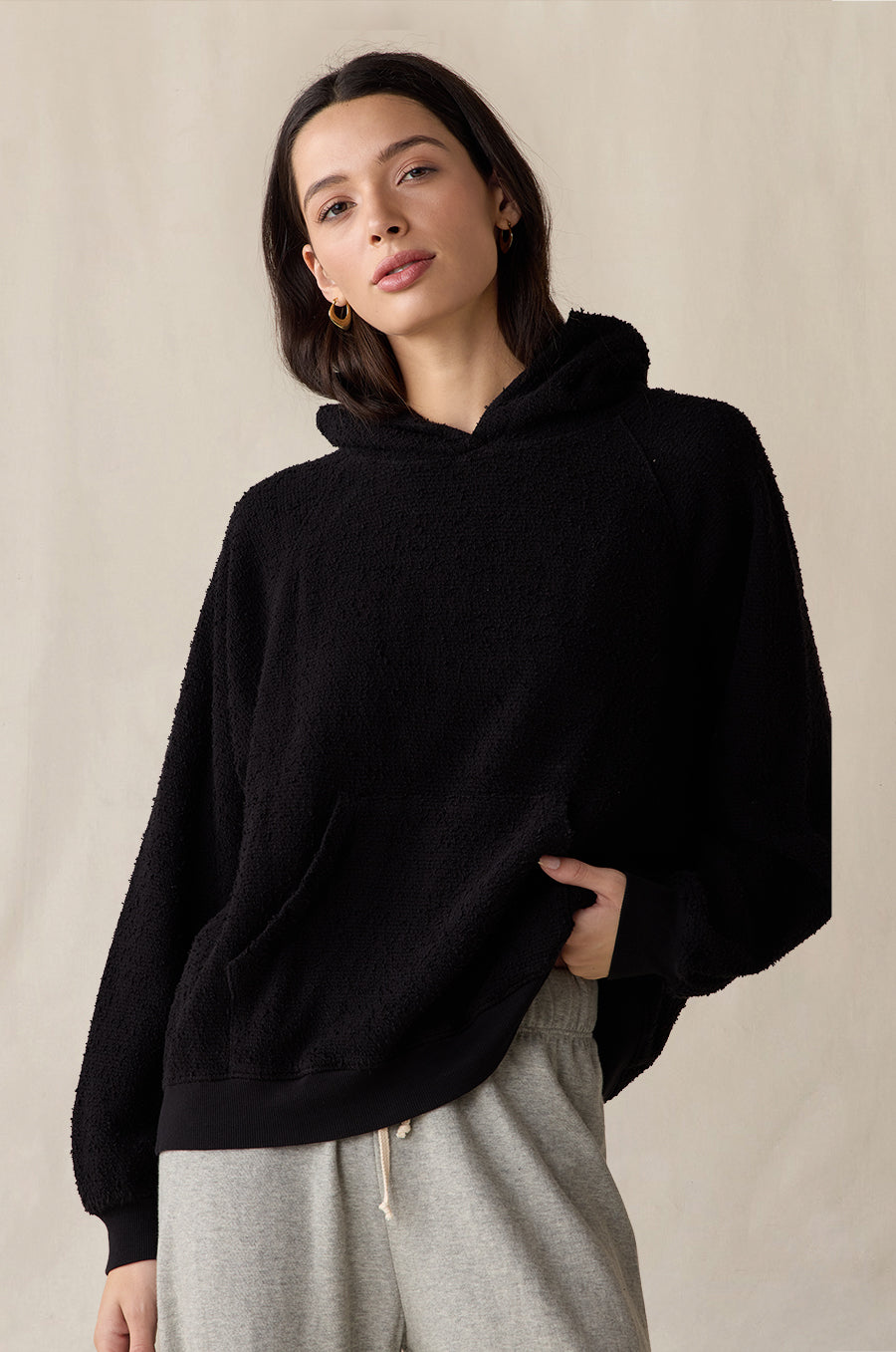 Tomboy Hoodie in black bouclé styled with the French Flare Pant in heather grey - the lady & the sailor