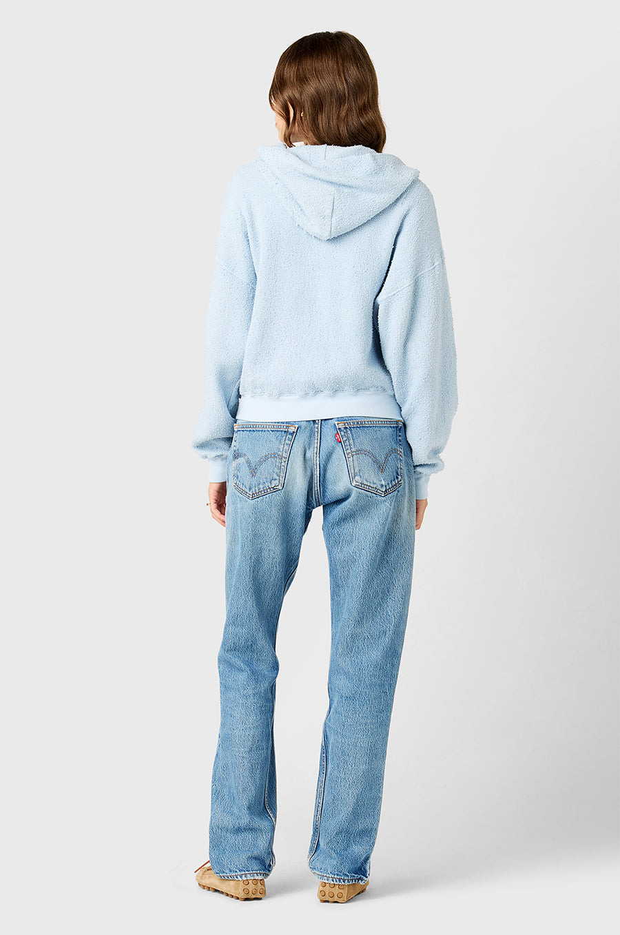 Model wearing the lady & the sailor Long Zip Up Hoodie in Powdery Blue Bouclé.