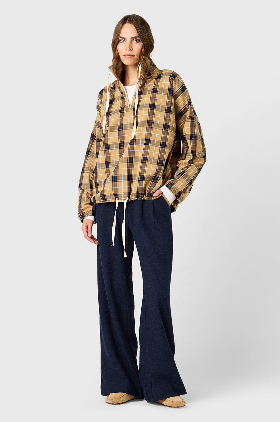 Model wearing The Lady & The Sailor Anorak in Camel Plaid - a quarter zip anorak with a tall collar and relaxed fit.