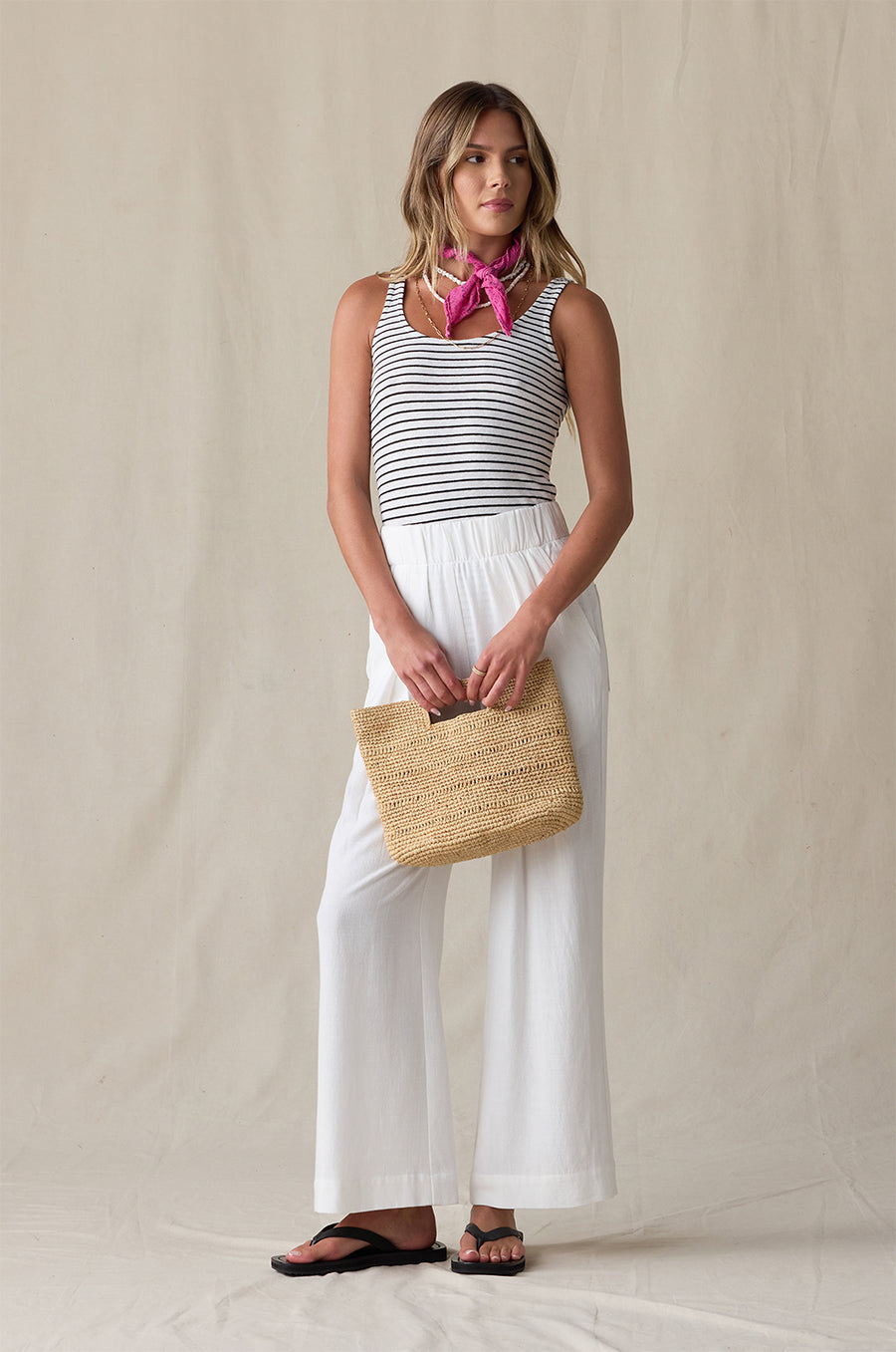 LAYER TANK IN BLACK/WHITE STRIPE STYLED WITH THE ANKLE PLEATED TROUSER IN IVORY AND THE NAOMI BAG IN NATURAL- the lady & the sailor