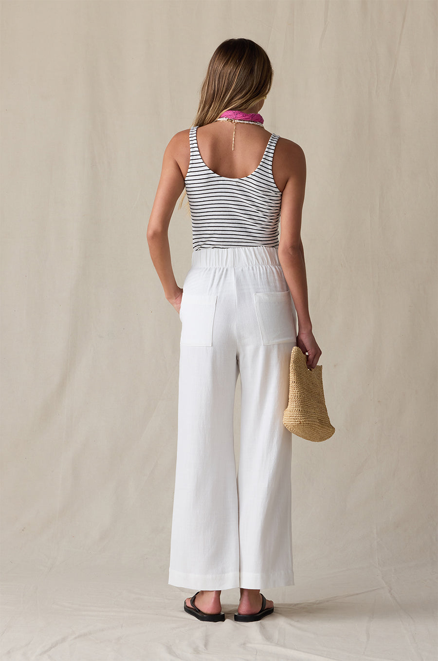 LAYER TANK IN BLACK/WHITE STRIPE STYLED WITH THE ANKLE PLEATED TROUSER IN IVORY AND THE NAOMI BAG IN NATURAL- the lady & the sailor