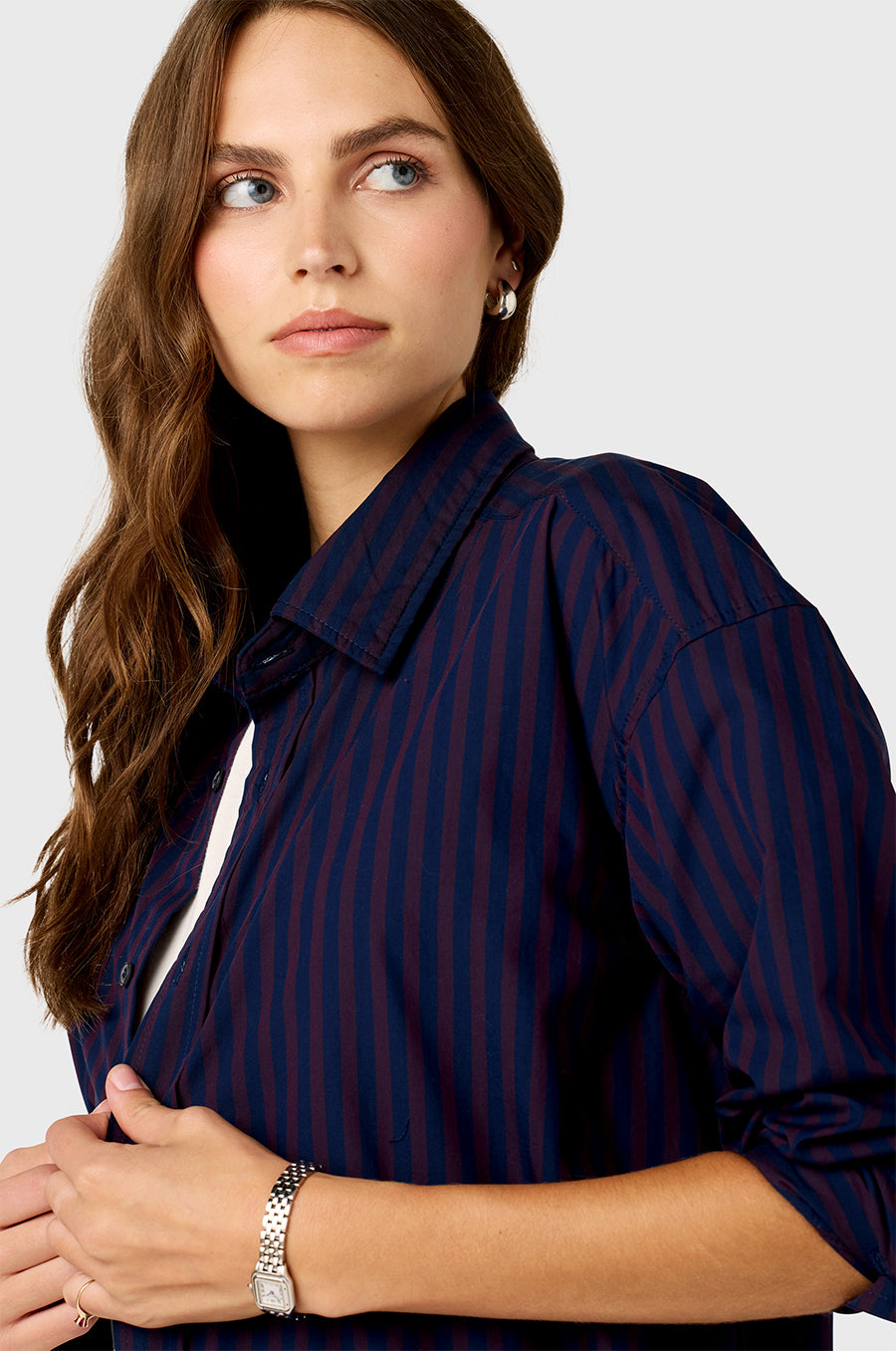 Model wearing The Lady & The Sailor Curved Hem Button up in Navy and Burgundy Stripe.