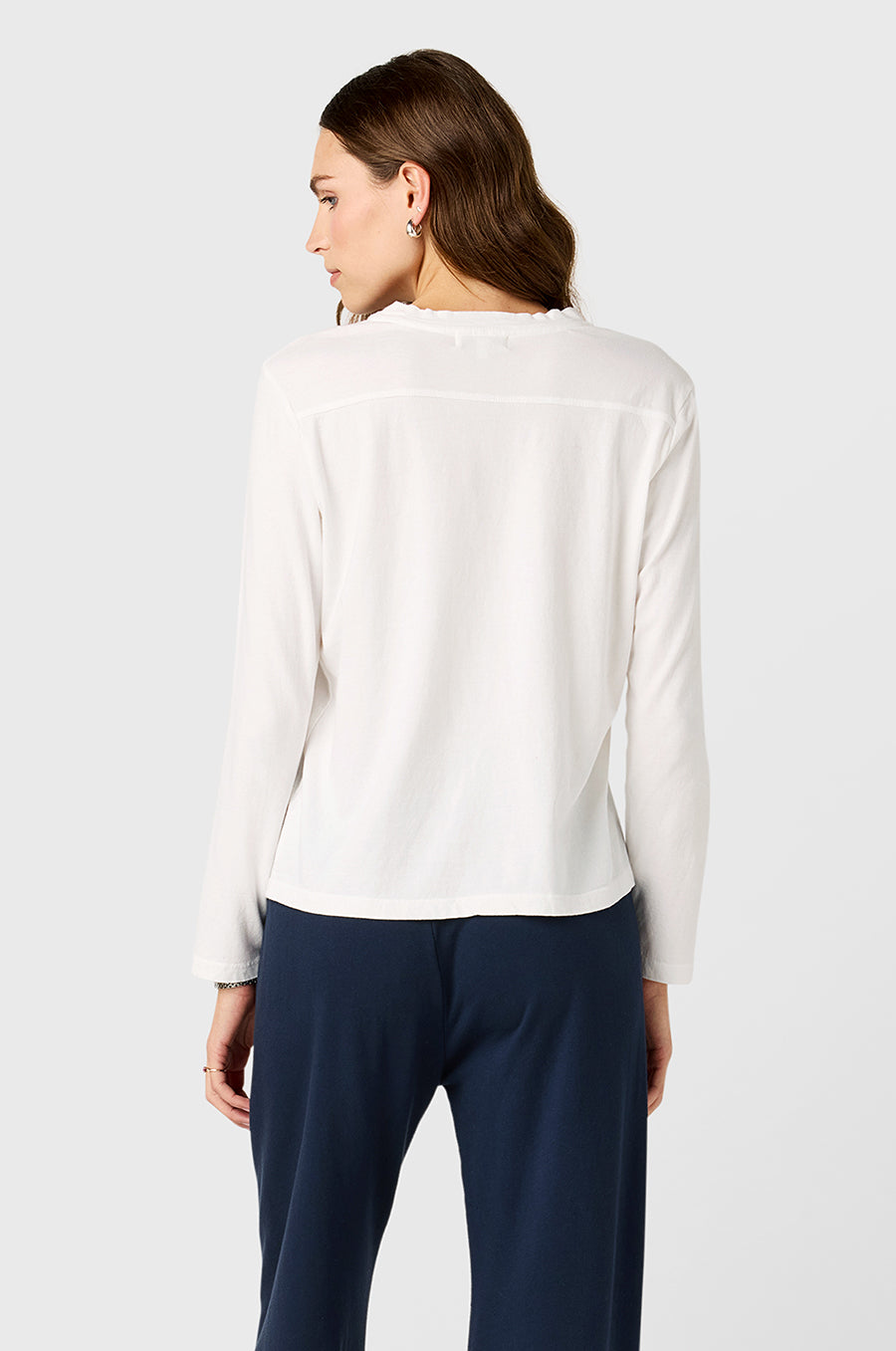 Model wearing the lady & the sailor Long Sleeve Boy Tee in White.