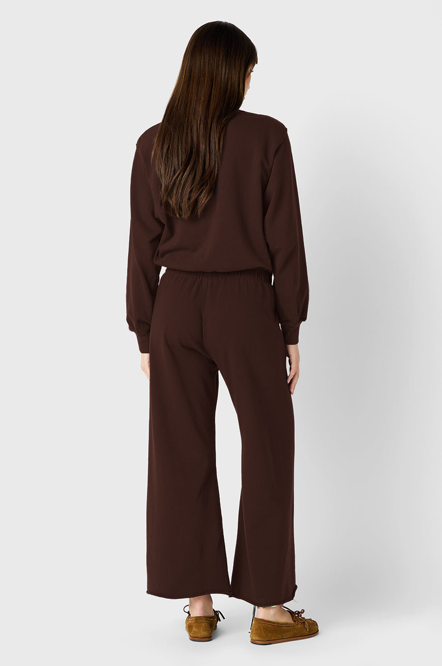 Brunette Model wearing the lady & the sailor French Flare Pant in Chocolate Organic Cotton.
