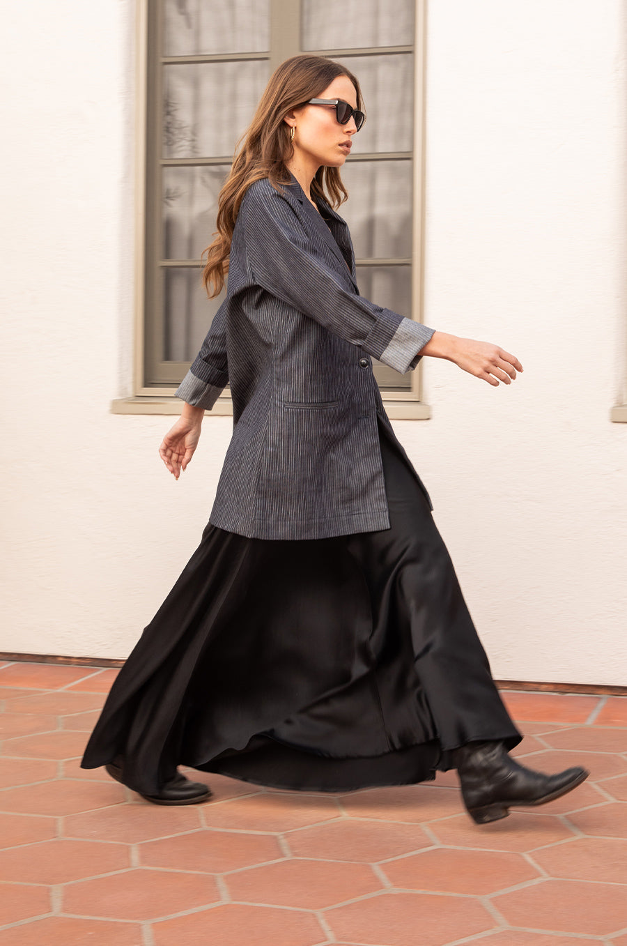 Model wearing the lady & the sailor the Relaxed Blazer in Dark Denim Stripe.