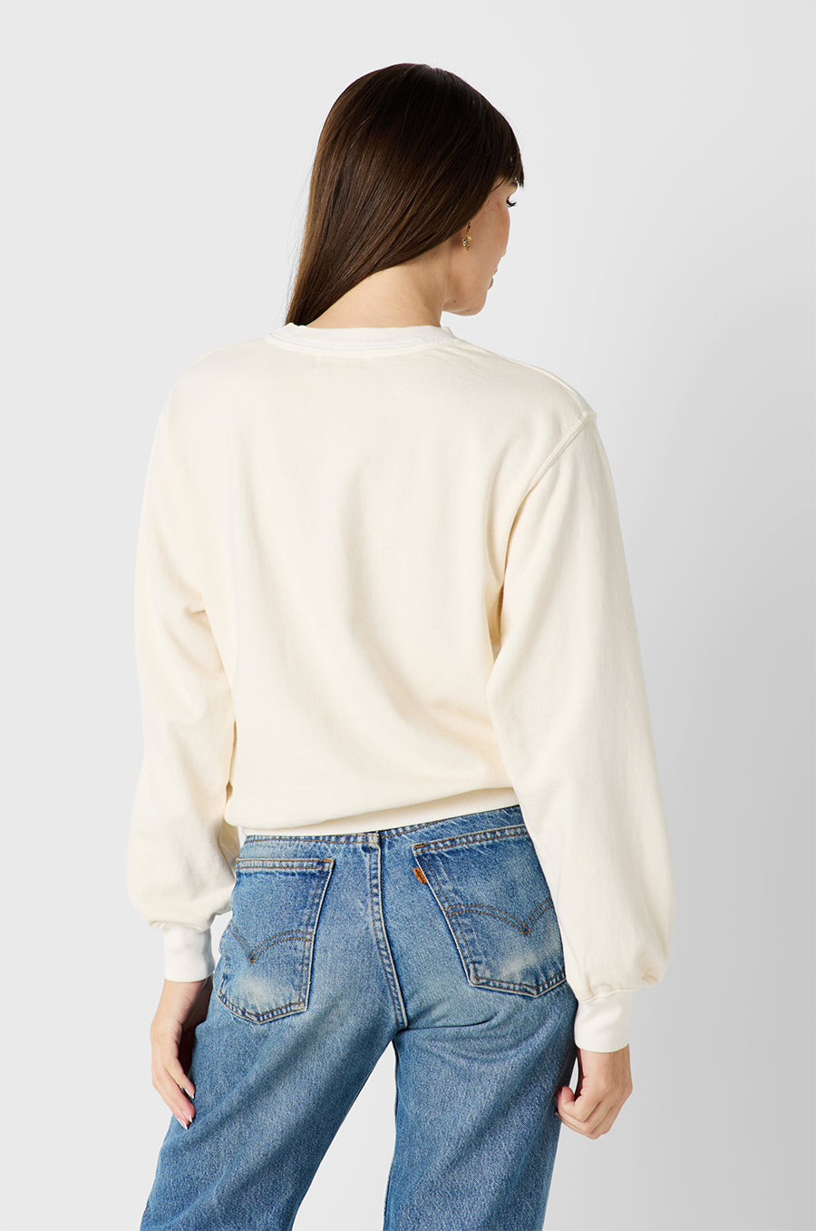 Brunette Model wearing the lady & the sailor Relaxed Sweatshirt in Vanilla Organic Cotton