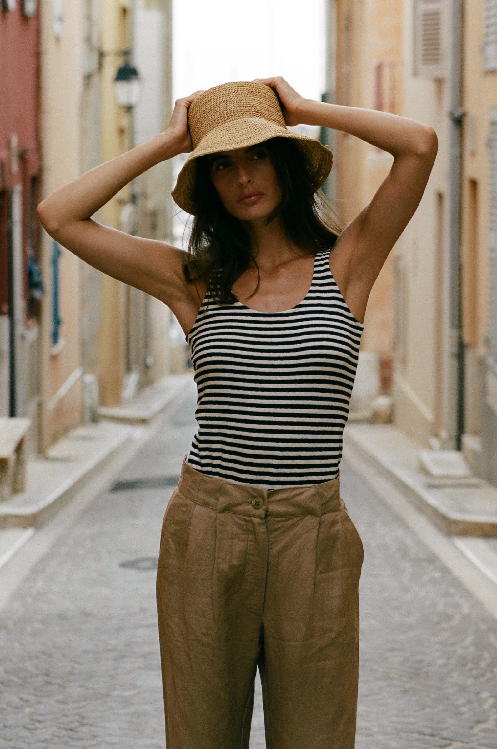 THE CROCHET BUCKET HAT IN NATURAL STYLED WITH THE LAYER TANK IN NAVY/NATURAL STRIPE AND THE SLOUCHY HIGH WAISTED TROUSER IN FLAX - the lady & the sailor