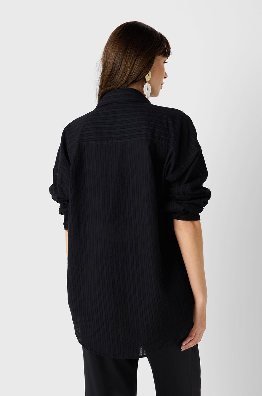 Brunette Model wearing the lady & the sailor Sunday Shirt in Black Pointelle Stripe