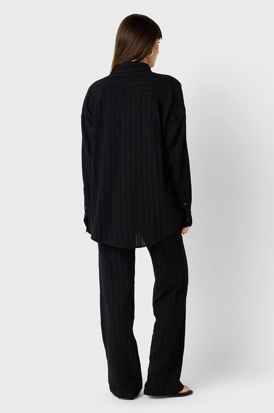 Brunette Model wearing the lady & the sailor Sunday Shirt in Black Beach Stripe