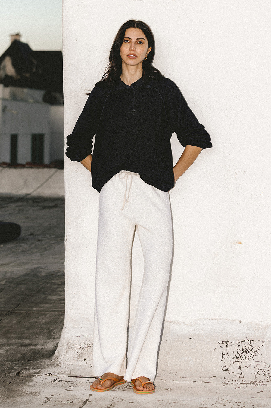 Mariner Fleece Polo in black and The Everyday Pant in vanilla bouclé - the lady & the sailor
