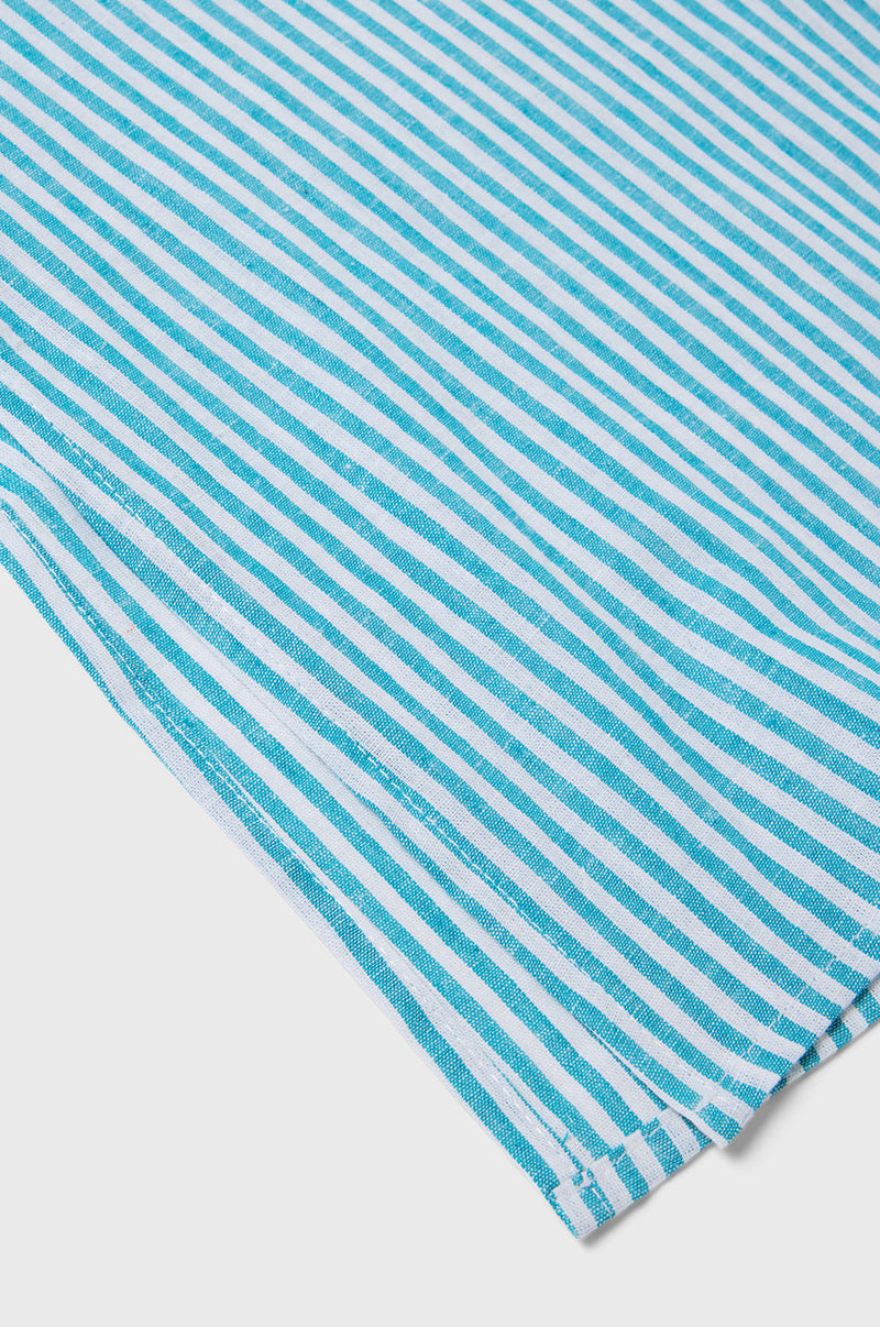 Close up shot showing the side slit of the Side Slit Tunic in Ocean Stripe