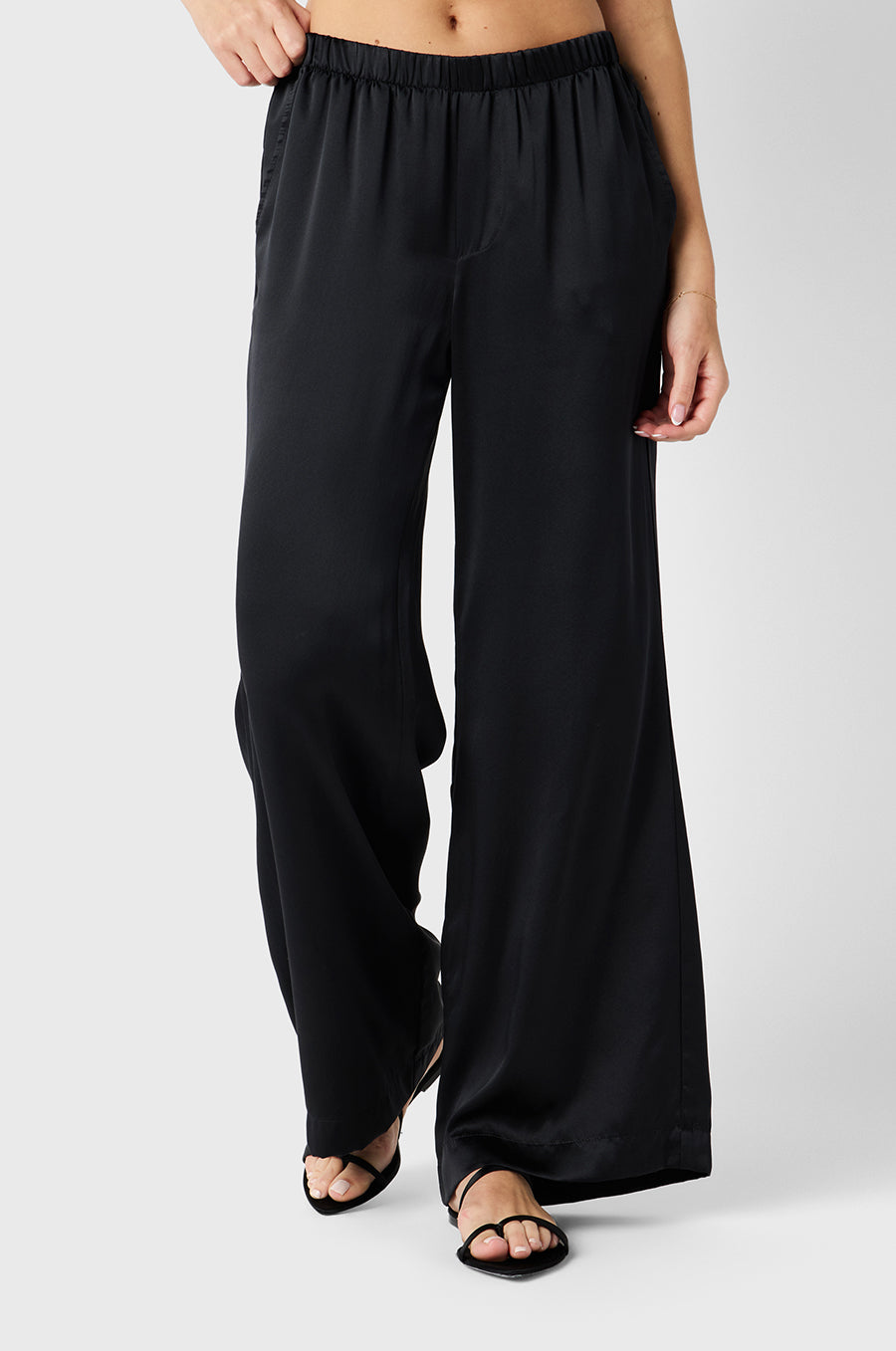 Brunette model wearing the lady & the sailor Wide Leg Pant in Black Silk