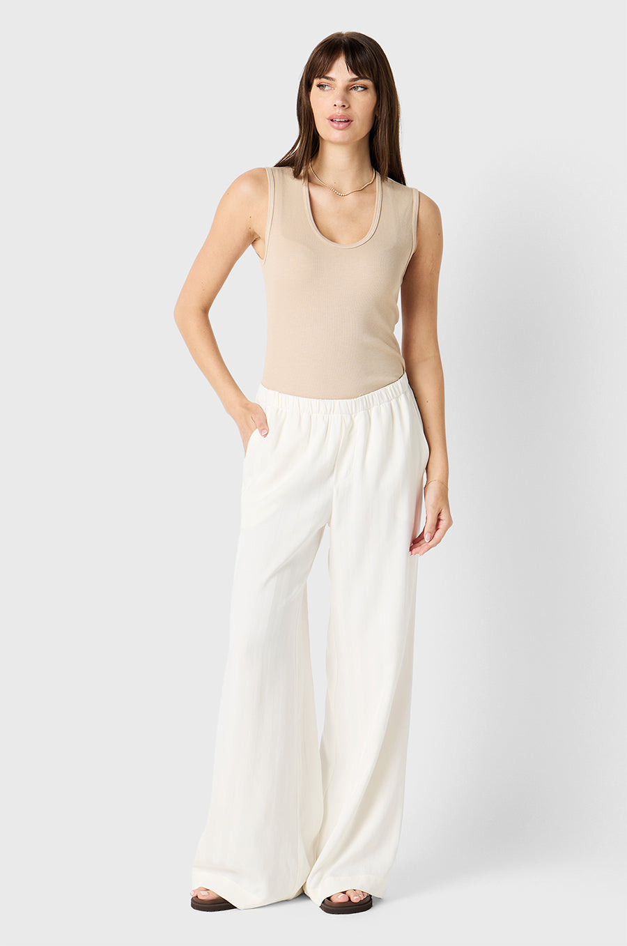Brunette model wearing the lady & the sailor Wide Leg Pant in Ivory Sateen Stripe