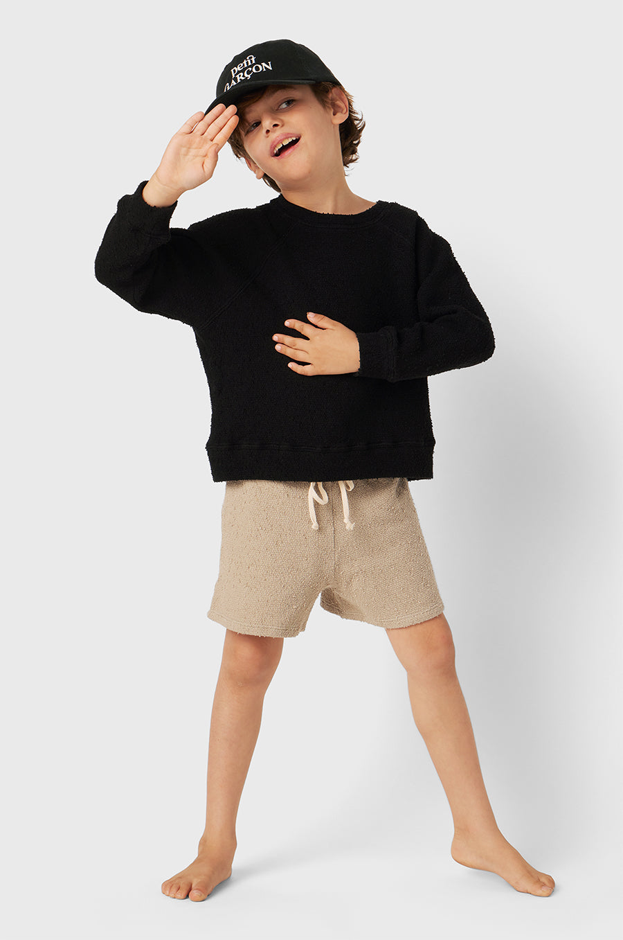 Model wearing Kids Weekend Short in Stone Bouclé little lady & petit sailor