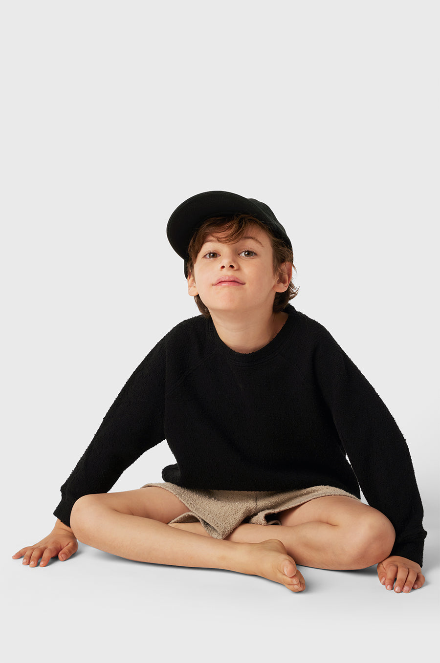 Model wearing Kids Weekend Short in Stone Bouclé little lady & petit sailor