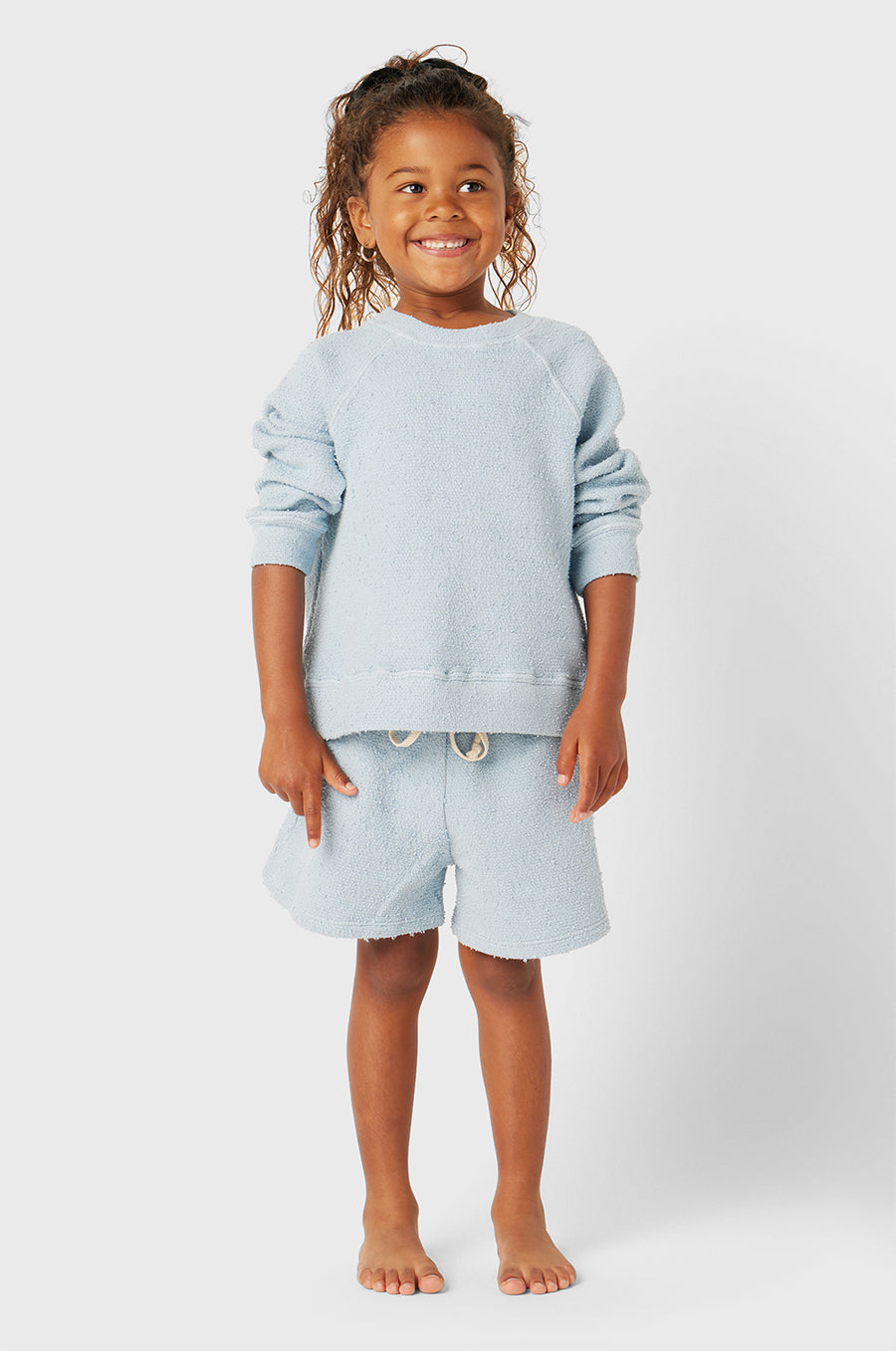 Model wearing Kids Weekend Short in Sky Blue Bouclé little lady & petit sailor