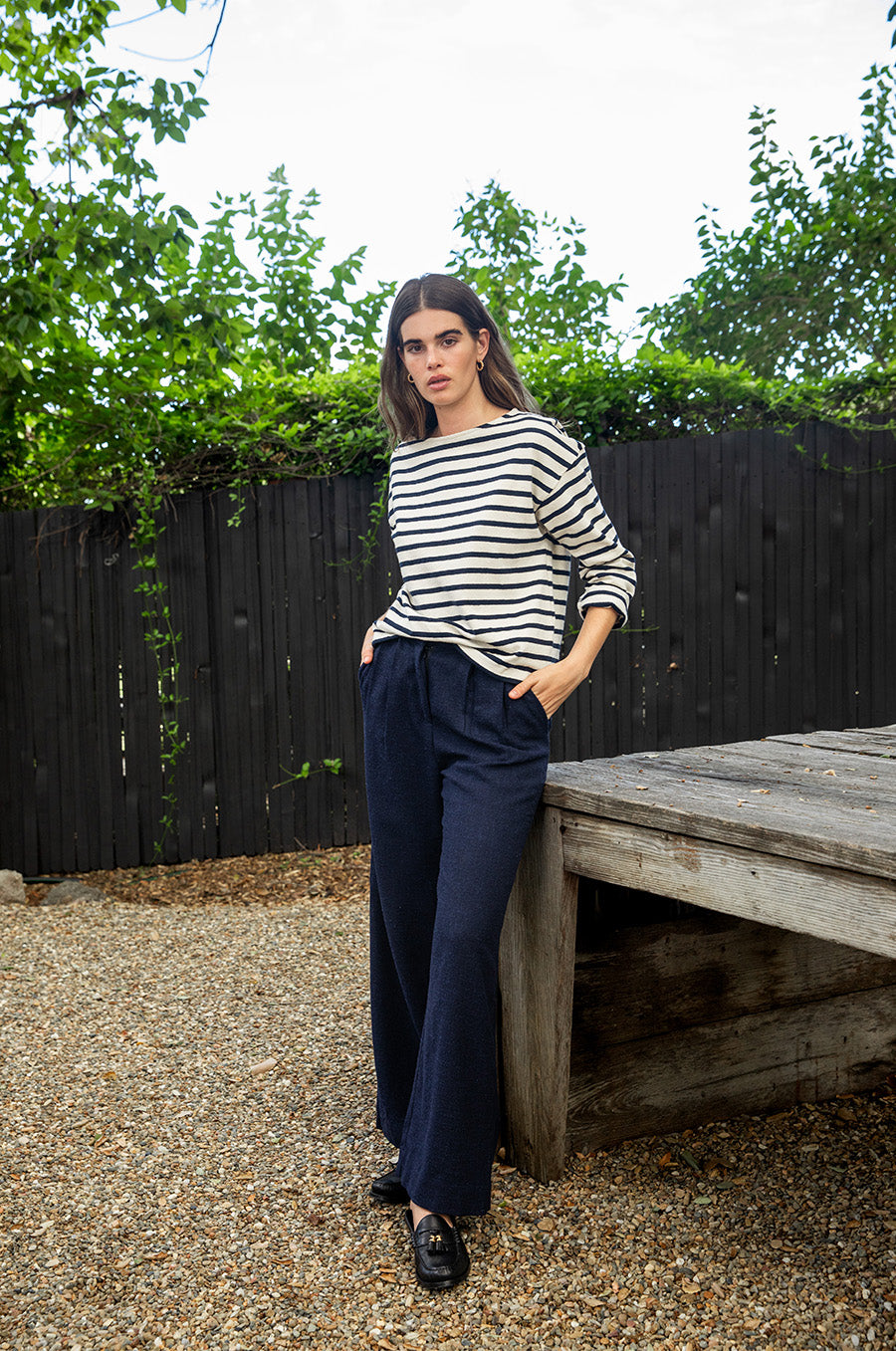 Brunette model wearing the lady & the sailor Boxy Pullover in Navy Stripe.