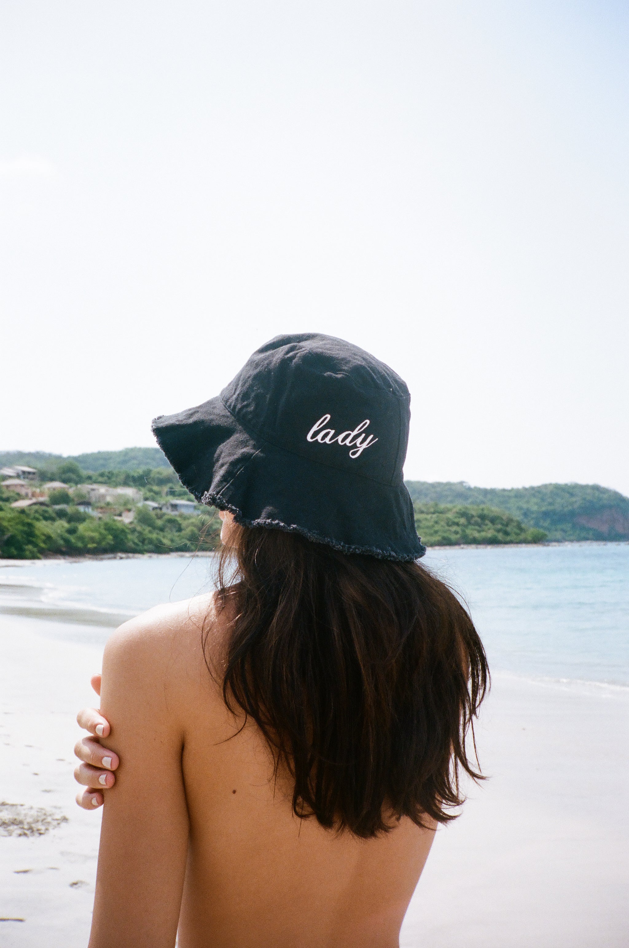Model wearing the lady and the sailor Lady Bucket Hat in black and white.