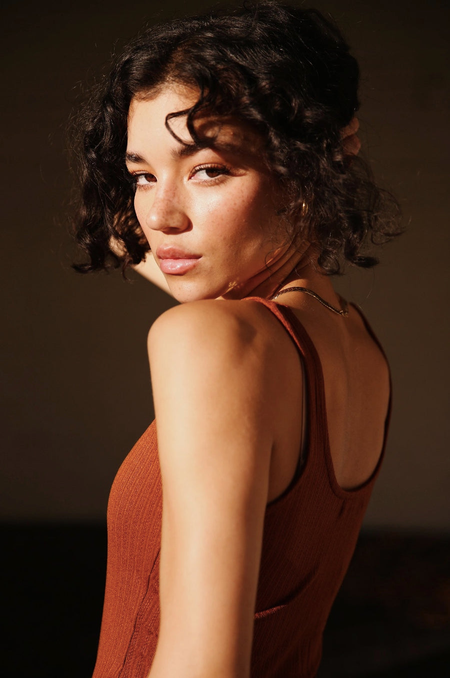 Model wearing the lady & the sailor Layer Tank in Copper Pointelle.