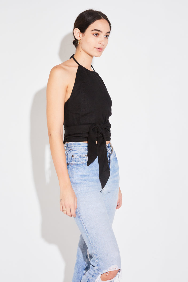 Model wearing the lady & the sailor Wrap Halter Top in black linen.