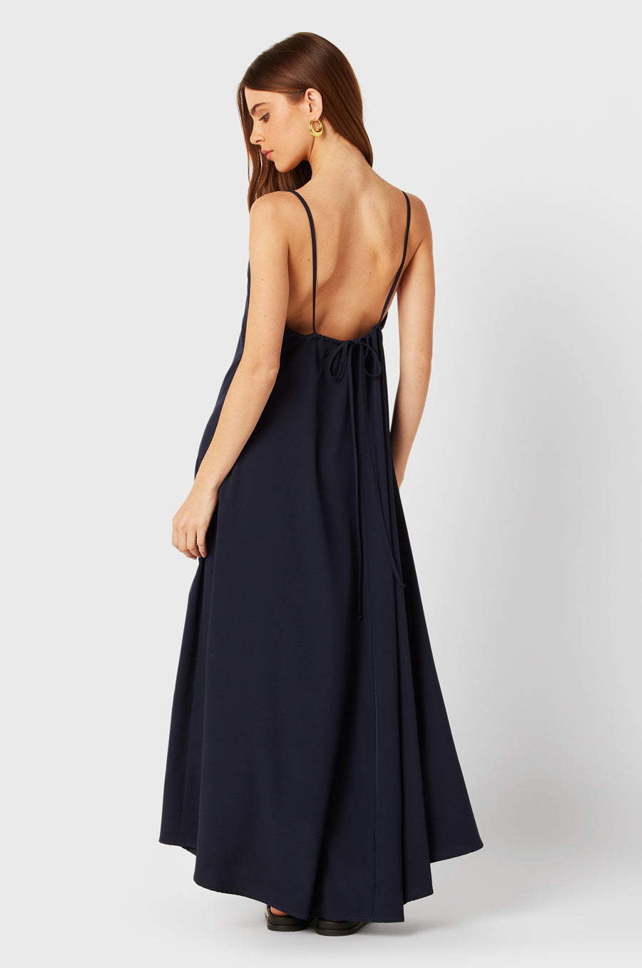 Brunette Model wearing the lady & the sailor Chloe Dress in Navy.