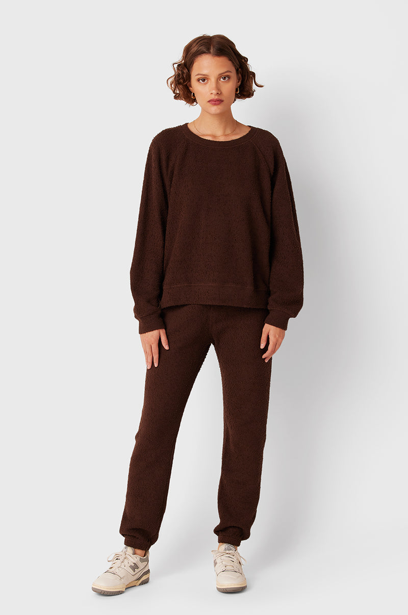 Brunette Model wearing the lady & the sailor Full Length Vintage Sweatpant in Chocolate Bouclé.