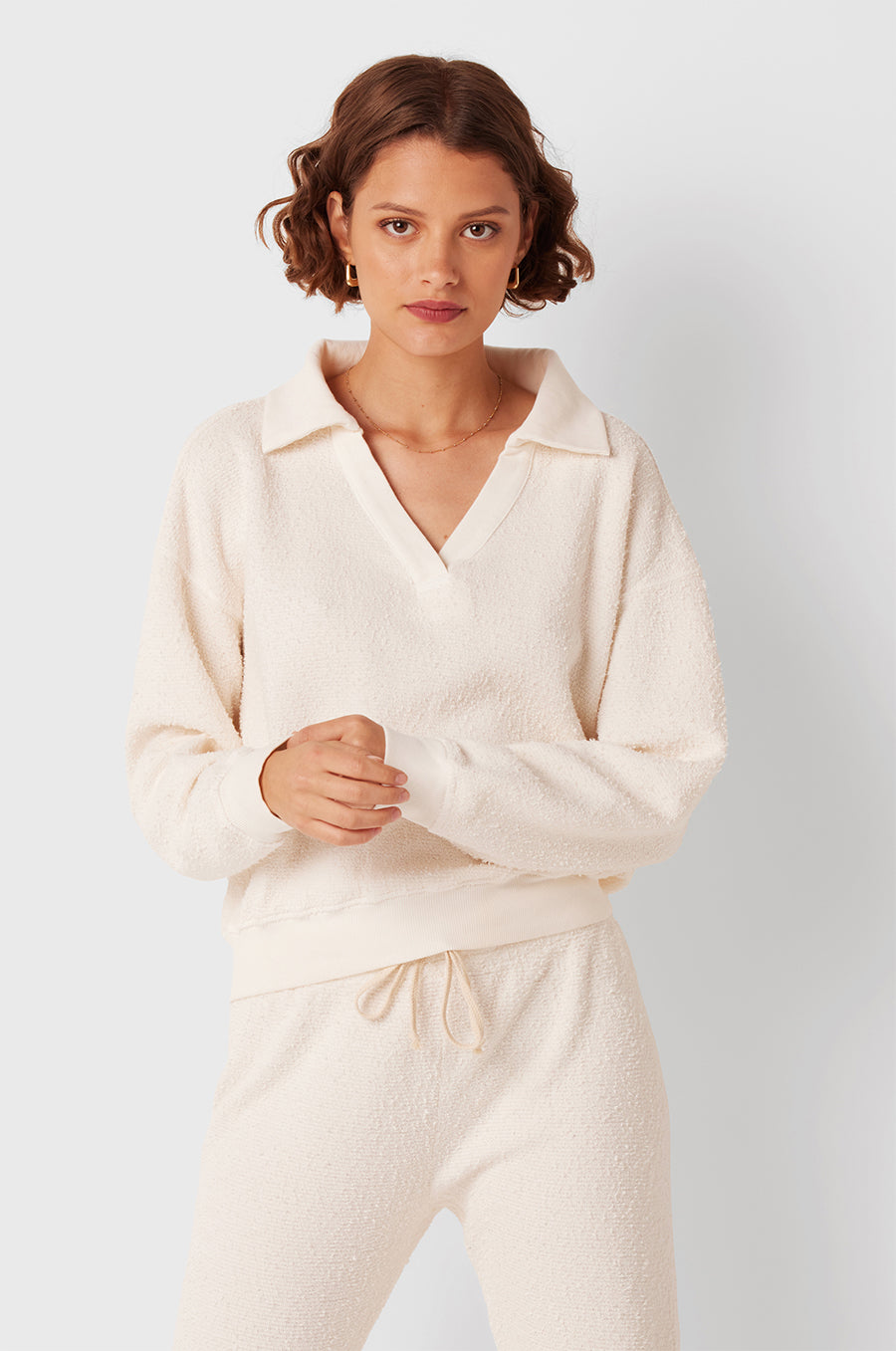 Brunette Model wearing the lady & the sailor Full Length Vintage Sweatpant in Vanilla Bouclé.