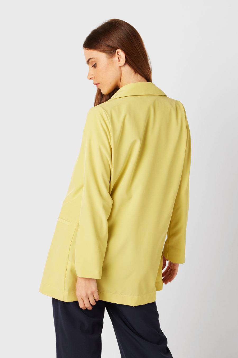Brunette Model wearing the lady & the sailor Relaxed Blazer in Citrine.