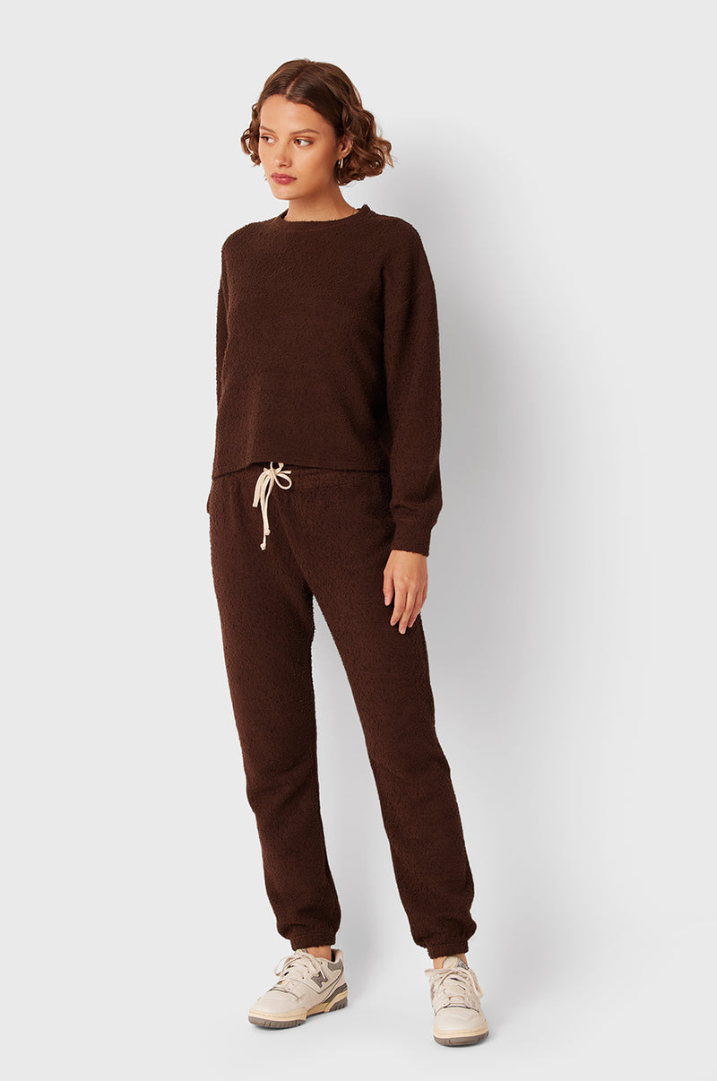 Brunette Model wearing the lady & the sailor Full Length Vintage Sweatpant in Chocolate Bouclé.