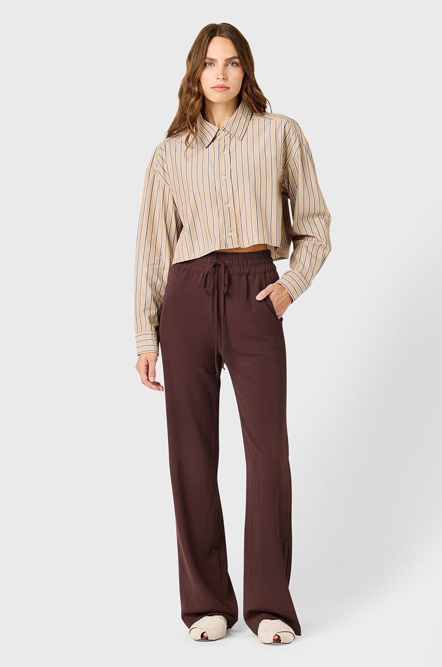 Model wearing the lady & the sailor High Waisted  Drawstring Pant in Chocolate Air Flow.