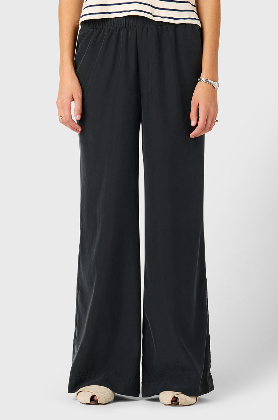 Model wearing The Lady & The Sailor Silky Wide Leg Pant in Washed Black.