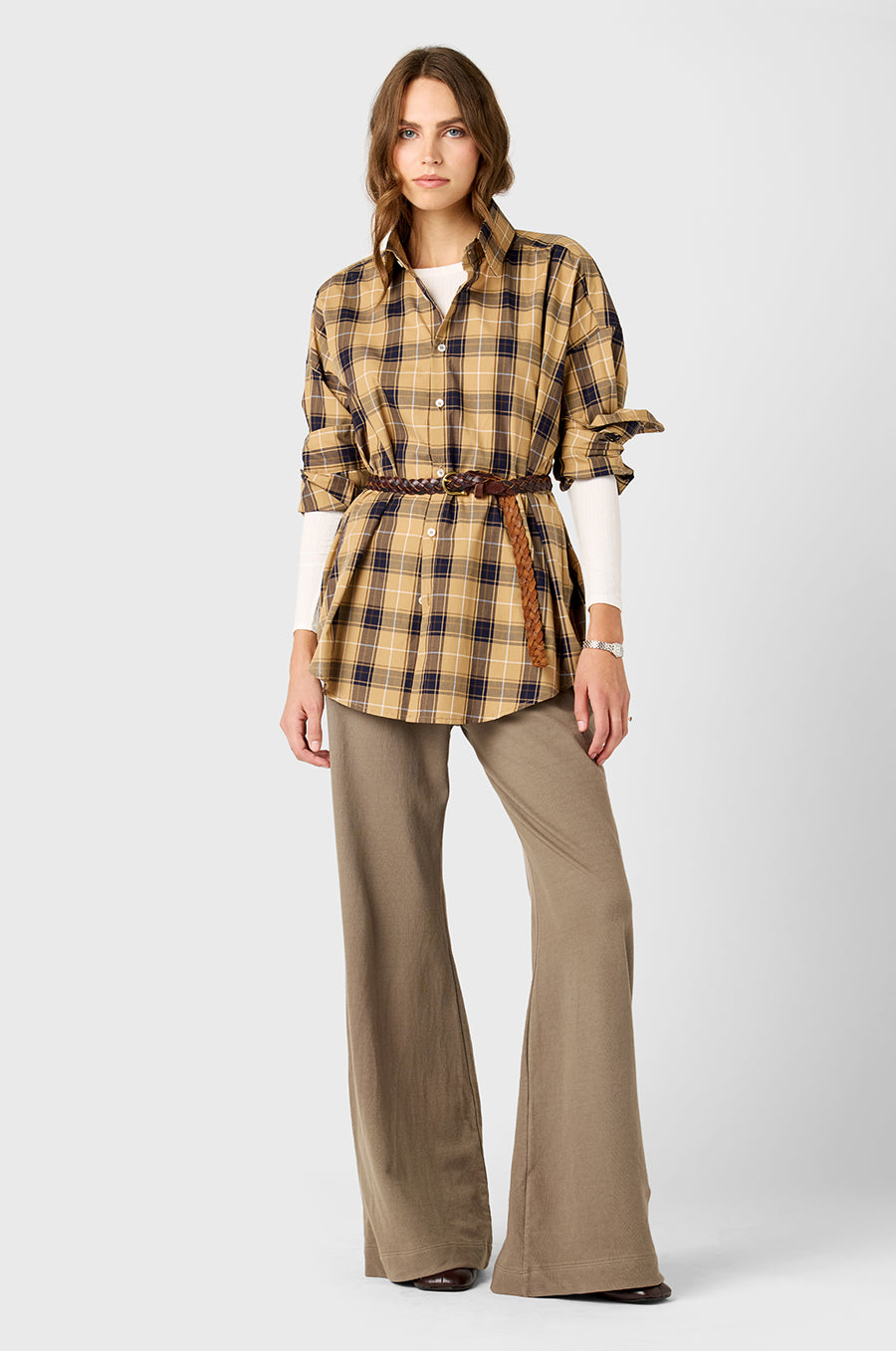 Model wearing The Lady & The Sailor Sunday Shirt in Camel Plaid, an oversized button up.