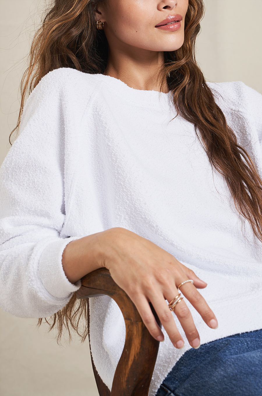 Model wearing the lady & the sailor Brentwood Sweatshirt in White Bouclé.
